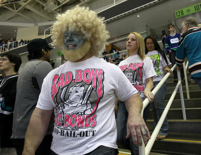 Jeff Stanley, far right, heads down to his seats before the San Jose Sharks game against the Vancouver Canucks with his daughter Cameron, 19, second from left, and their friend Amanda Mosher, 19, far right, for Game 4 of the Western Conference Finals at HP Pavilion in San Jose, Calif. on Sunday, May 22, 2011. (Nhat V. Meyer/Mercury News)