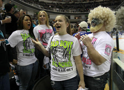 Jeff Stanley, far right, chat with other Sharks fans during warm-ups before the San Jose Sharks game against the Vancouver Canucks with his two daughters Chandler, 12, second from right, and Cameron, 19, second from left, and their friend Amanda Mosher, 19, far left, for Game 4 of the Western Conference Finals at HP Pavilion in San Jose, Calif. on Sunday, May 22, 2011. (Nhat V. Meyer/Mercury News)