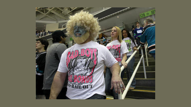 Jeff Stanley, far right, heads down to his seats before the San Jose Sharks game against the Vancouver Canucks with his daughter Cameron, 19, second from left, and their friend Amanda Mosher, 19, far right, for Game 4 of the Western Conference Finals at HP Pavilion in San Jose, Calif. on Sunday, May 22, 2011. (Nhat V. Meyer/Mercury News)